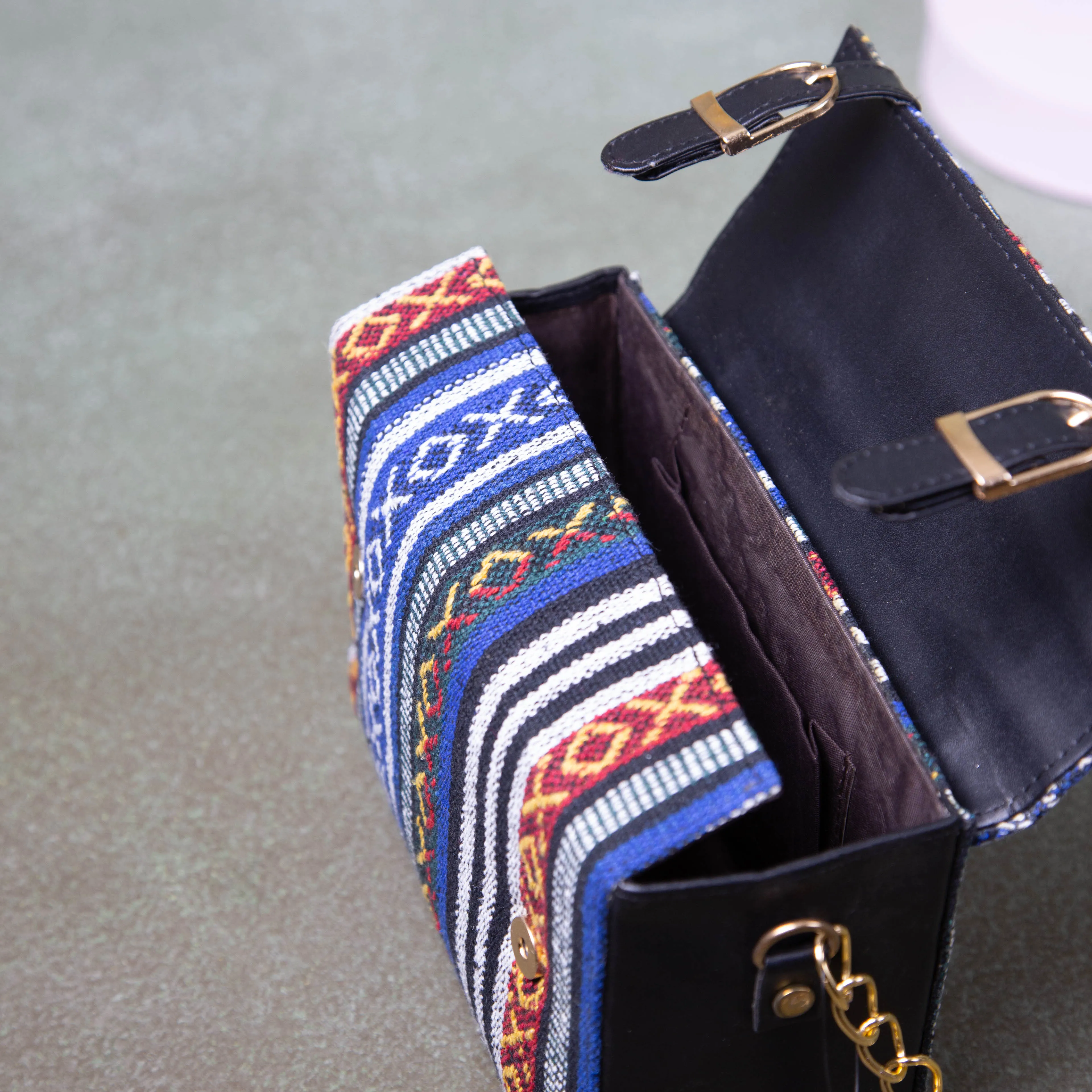 Cuboid Case Sling bags Blue with Red Colour Design.