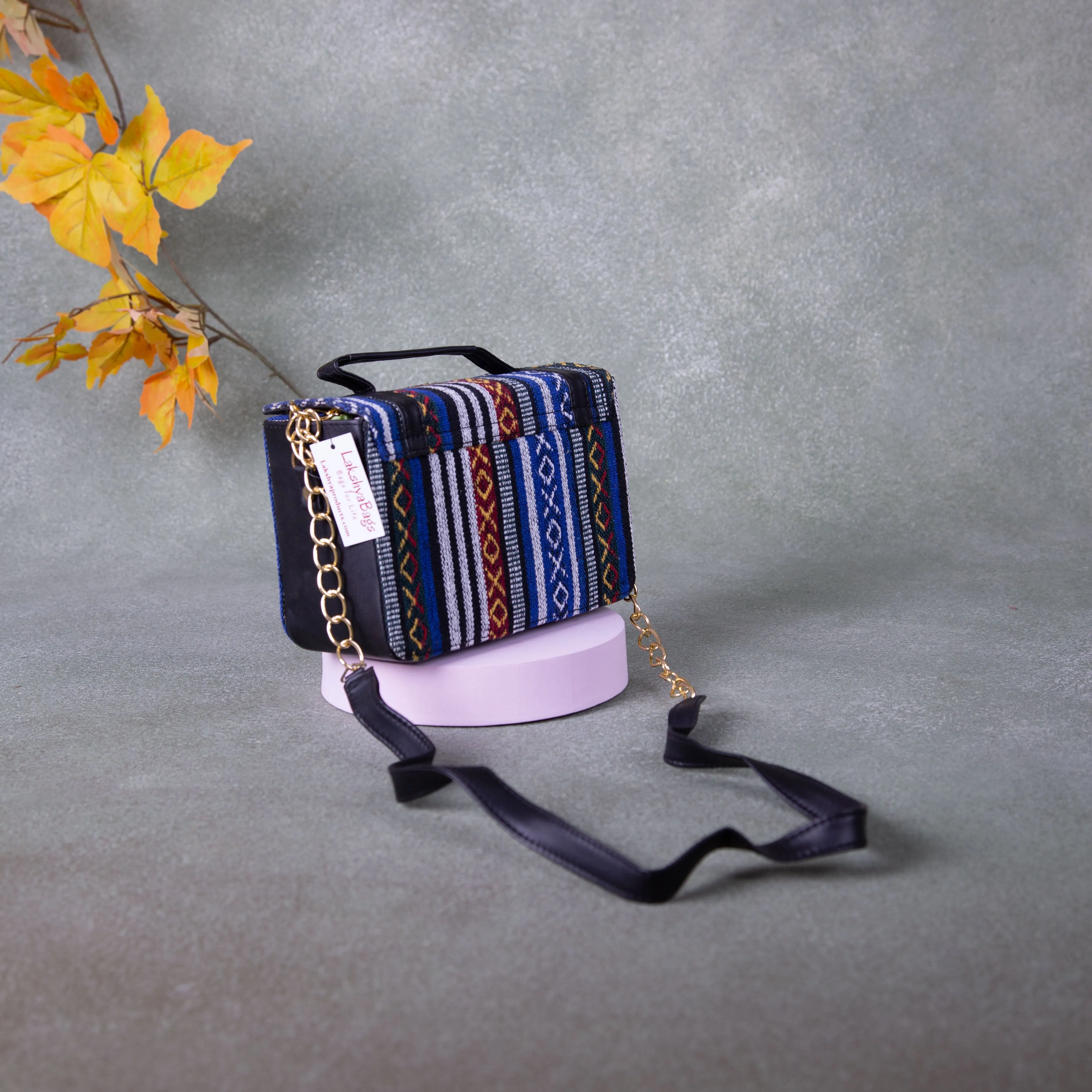 Cuboid Case Sling bags Blue with Red Colour Design.