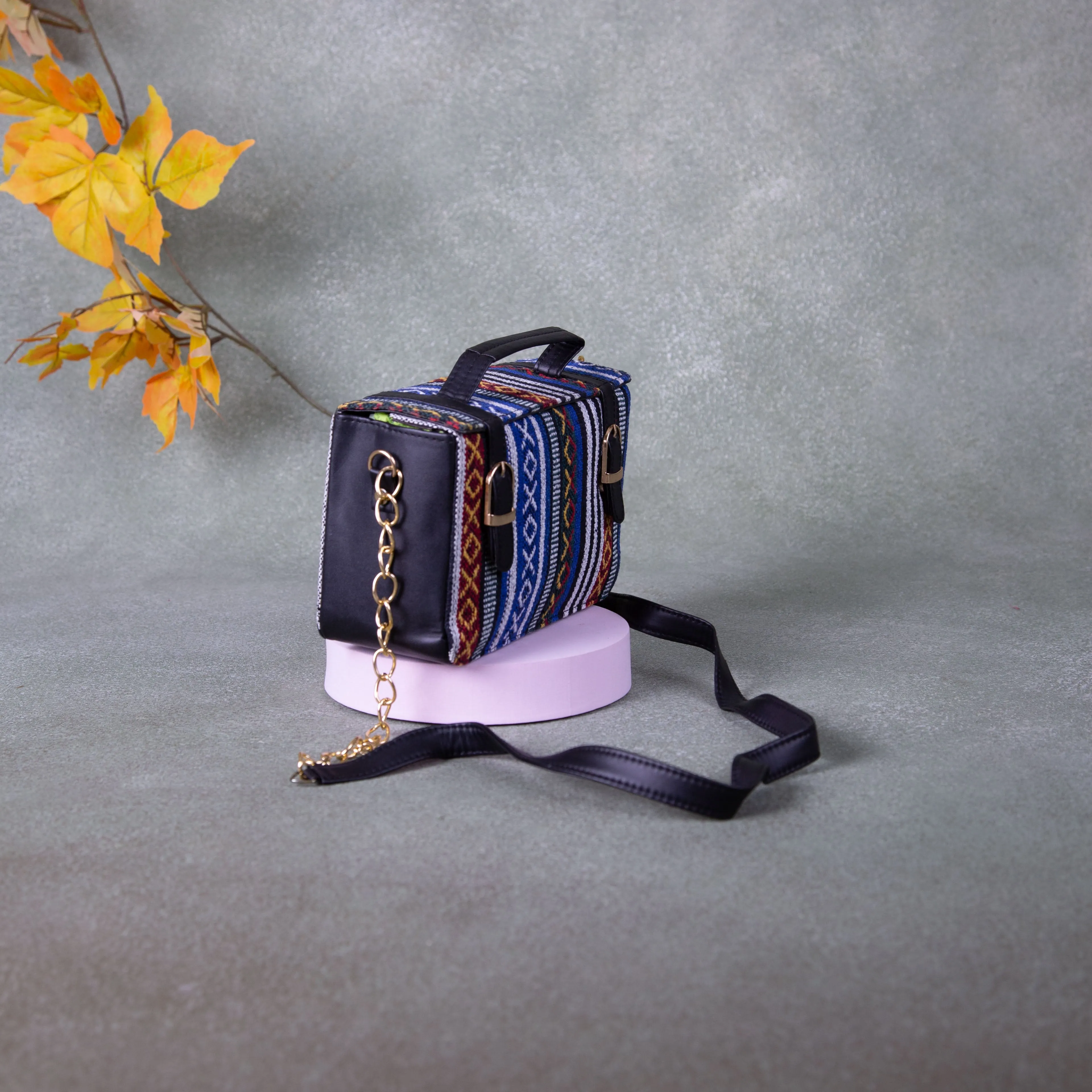 Cuboid Case Sling bags Blue with Red Colour Design.